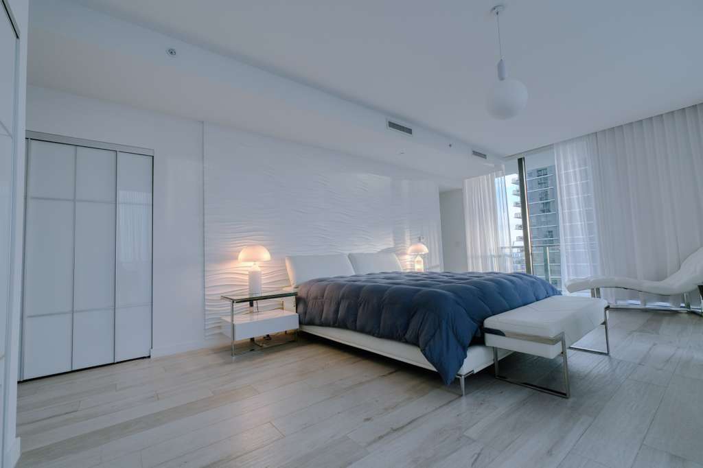 Primary suite with terrace access and skyline light