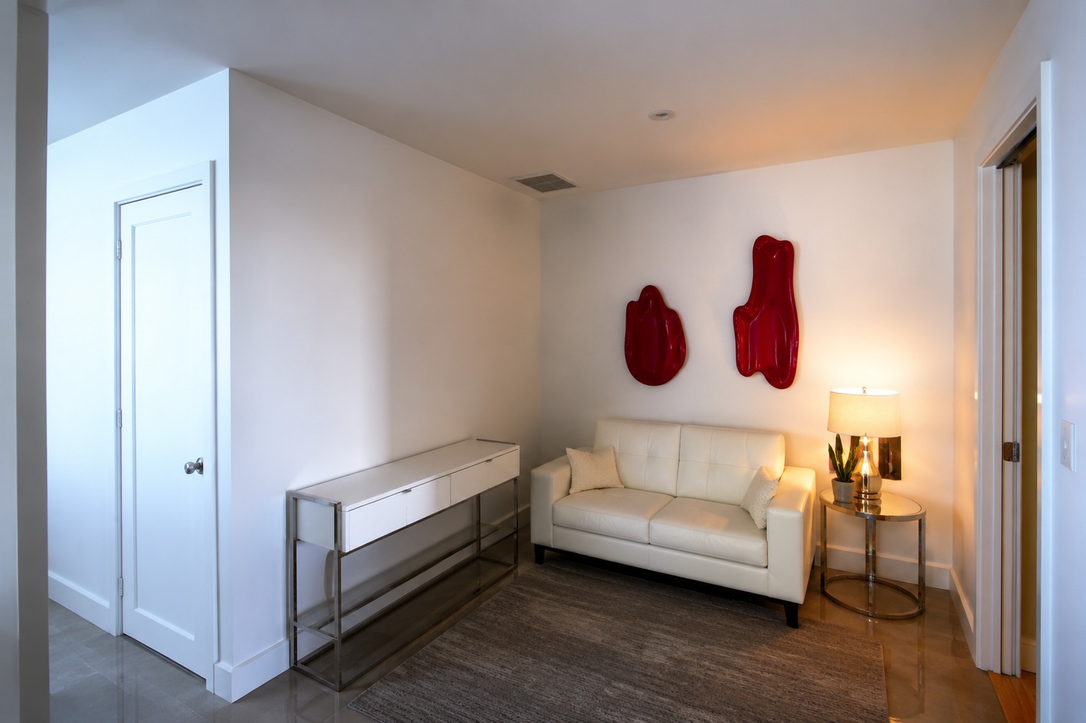 Open den arranged as a comfortable reading and conversation retreat